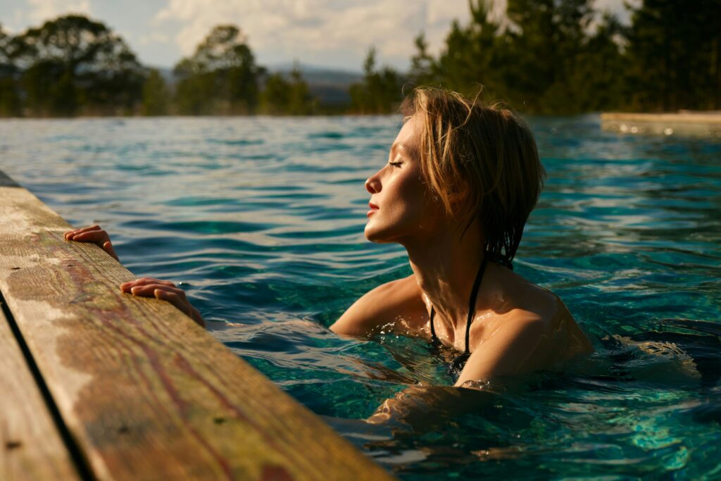a woman doing some energy cleanse by swimming