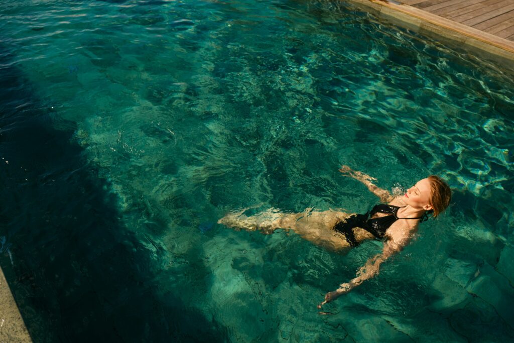 a woman doing some energy cleanse by swimming